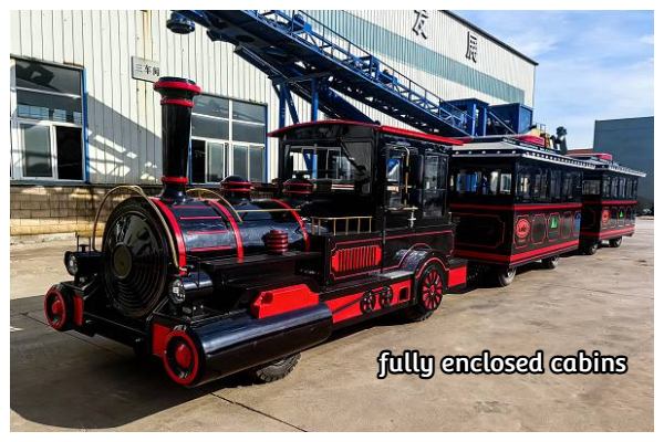 vintage diesel trackless train with fully enclosed cabins